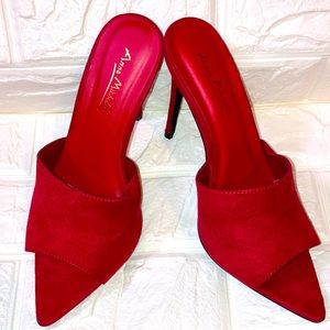 Sexy Anne Michelle Red stilettos with no backs. Size 7
